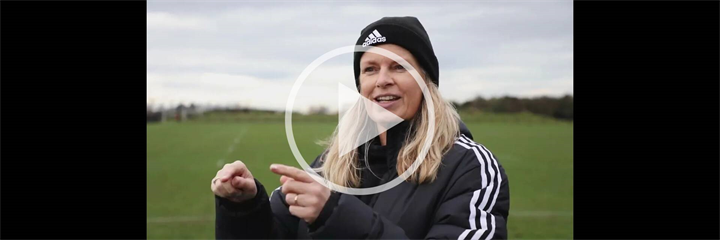 Photo of Dr Kirsty Fairbairn in front of a field, with a play button overlaid